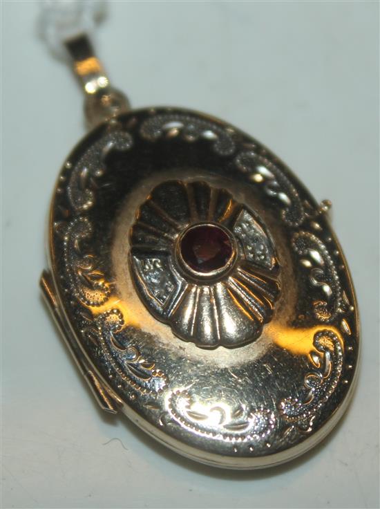 Gold diamond & red stone locket